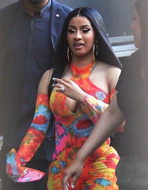 Cardi B boobs and booty on display on and off stage showing nice cleavage and her sexy ass in a tight dress.























