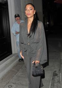 Nicole Scherzinger sexy in a see through outfit showing her braless boobs and ass seen by paparazzi.
