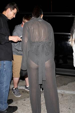 Nicole Scherzinger sexy in a see through outfit showing her braless boobs and ass seen by paparazzi.
