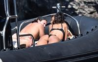Madalina Diana Ghenea sexy ass and cleavage in a thong bikini seen by paparazzi.


