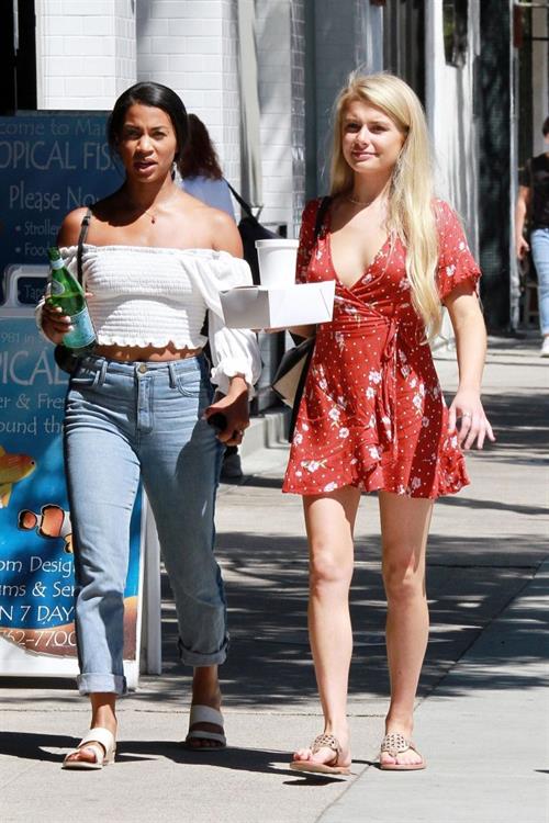 Demi Burnett braless boobs in a low cut dress showing nice cleavage seen by paparazzi.






