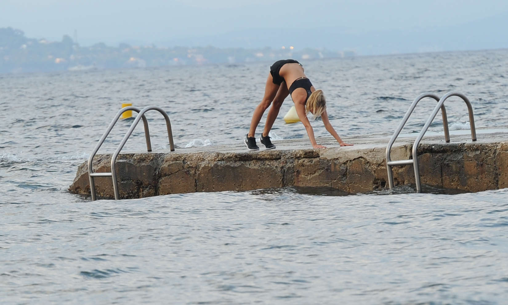 Kimberley Garner Bikini Pictures Kimberley Garner at the beach with her dog
