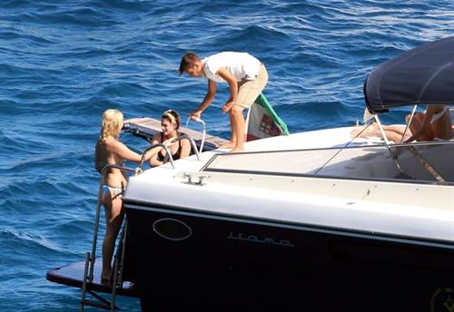 Kristen Stewart Bikini Pictures Kristen Stewart and Stella Maxwell sexy lesbians making out on a boat in bikinis seen by paparazzi.