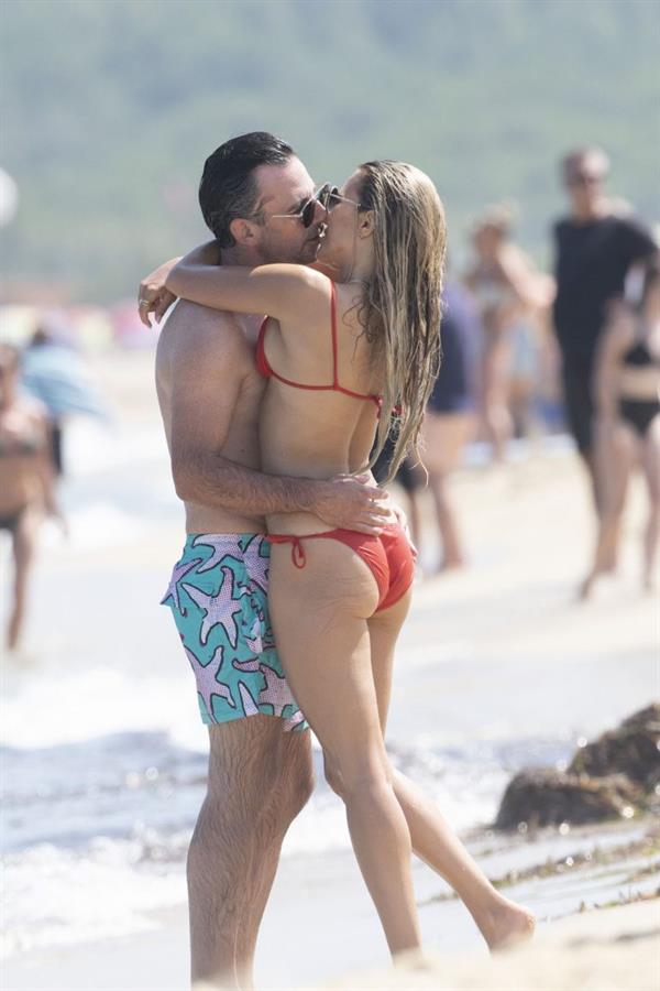 Sylvie Meis sexy ass in a bikini at the beach with her new boyfriend at the beach seen by paparazzi.















