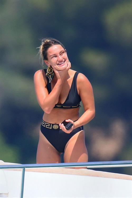 Sam Faiers Bikini Pictures Sam Faiers sexy in a black versace bikini seen by paparazzi showing nice cleavage.