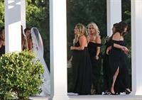 Selena Gomez sexy in a black dress for her cousins wedding showing nice cleavage seen by paparazzi.























