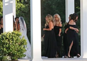 Selena Gomez sexy in a black dress for her cousins wedding showing nice cleavage seen by paparazzi.























