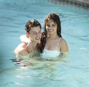 Camila Cabello and Shawn Mendes making out in the water seen kissing by paparazzi.





































