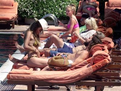 Heidi Klum nip slip in a sexy bikini seen by paparazzi and kissing her husband and flashing her boob.


