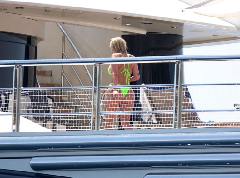 Stassie Karanikolaou Bikini Pictures Stassie Karanikolaou sexy ass in a green thong bikini showing nice cleavage with her big boobs seen by paparazzi.