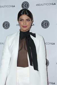 Priyanka Chopra braless boobs in a see through top showing some nice cleavage at Beautycon.

