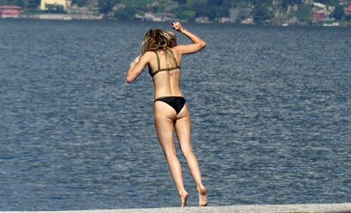 Miley Cyrus Bikini Pictures Miley Cyrus and Kaitlynn Carter making out kissing by the pool seen by paparazzi showing her lesbian side after leaving Liam Hemsworth.