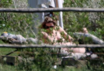 Alejandra Silva caught topless with her nude boobs exposed by paparazzi on vacation.
