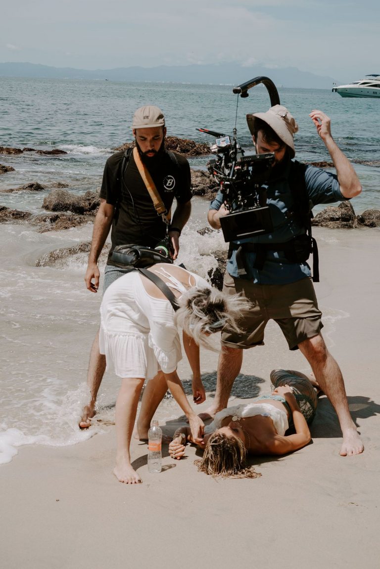 Kristin Cavallari Pictures Kristin Cavallari topless seen by paparazzi at the beach covering her nude boobs with her arms.