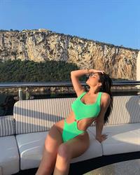Kylie Jenner sexy ass in a swimsuit on her mega yacht seen by paparazzi.

