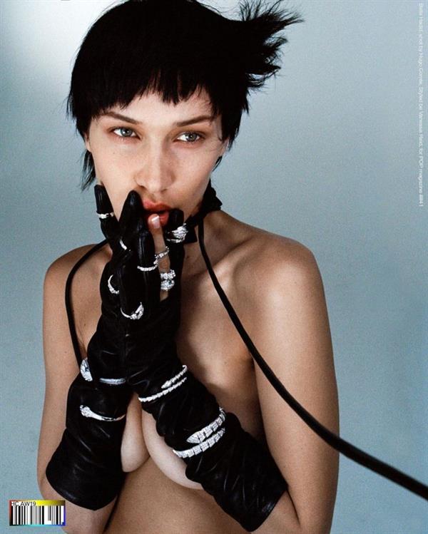 Bella Hadid topless new photo shoot for POP magazine covering her nude boobs with her arms.

