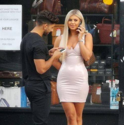 Belle Hassan Pictures Belle Hassan wardrobe malfunction as the ass of her dress rips she had to call someone to sew it seen by paparazzi.