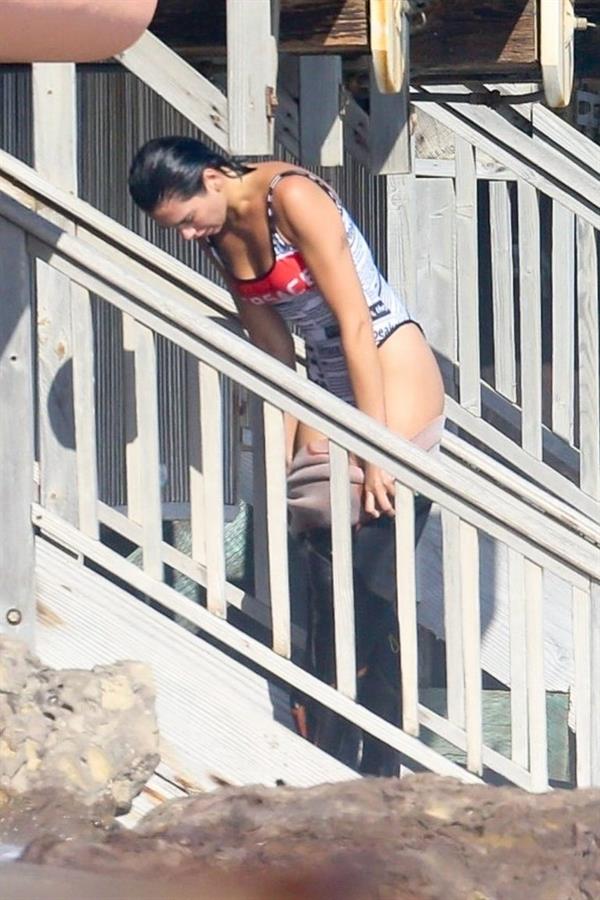 Dua Lipa sexy ass and cleavage in a swimsuit at the beach seen with her boyfriend by paparazzi.













