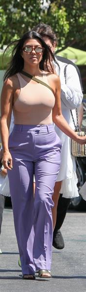 Kourtney Kardashian braless boobs in a nude tank top showing off her tits pokies with Kris Jenner seen by paparazzi.














