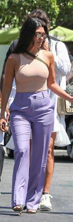 Kourtney Kardashian braless boobs in a nude tank top showing off her tits pokies with Kris Jenner seen by paparazzi.














