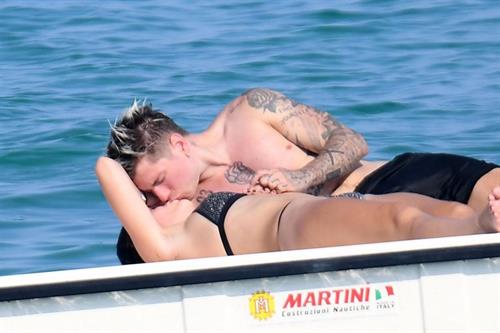 Bella Thorne Bikini Pictures Bella Thorne making out and having fun with her boyfriend in a sexy little bikini seen by paparazzi.