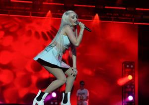 Kim Petras upskirt on stage singing and showing her panties.







