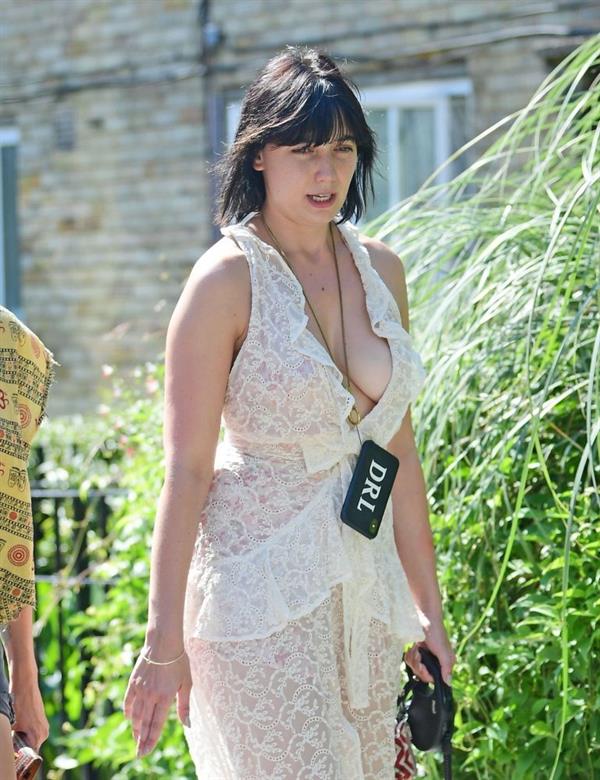 Daisy Lowe braless boobs in a see through dress showing off her tits and cleavage seen by paparazzi.












































