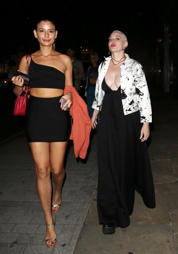 Rose McGowan braless boobs showing nice cleavage in a low cut dress with Lottie Moss seen by paparazzi. 