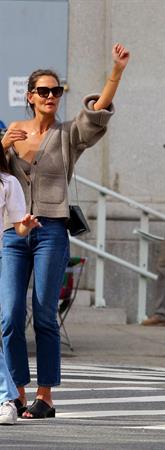 Katie Holmes sexy cleavage seen by paparazzi in a revealing outfit.

