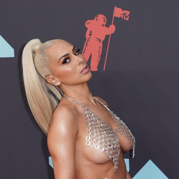 Veronica Vega showing off her braless boobs on the red carpet at the MTV VMA's in a see through top.














