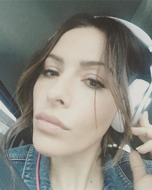 Sarah Shahi taking a selfie