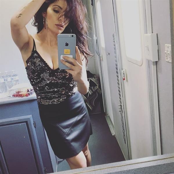 Sarah Shahi taking a selfie