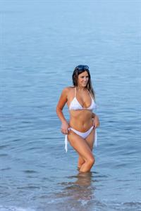 Claudia Romani see ass in a thong bikini at the beach seen by paparazzi showing nice cleavage.












































