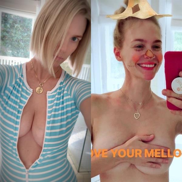 January Jones nude boobs covering her topless tits with her hand.











