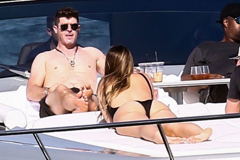 April Love Geary sexy ass in a thong swimsuit also showing nice cleavage seen on a yacht with Robin Thicke by paparazzi.




