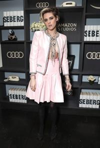 Kristen Stewart braless boobs showing nice cleavage in an open pink dress photographed at Amazon Studios.