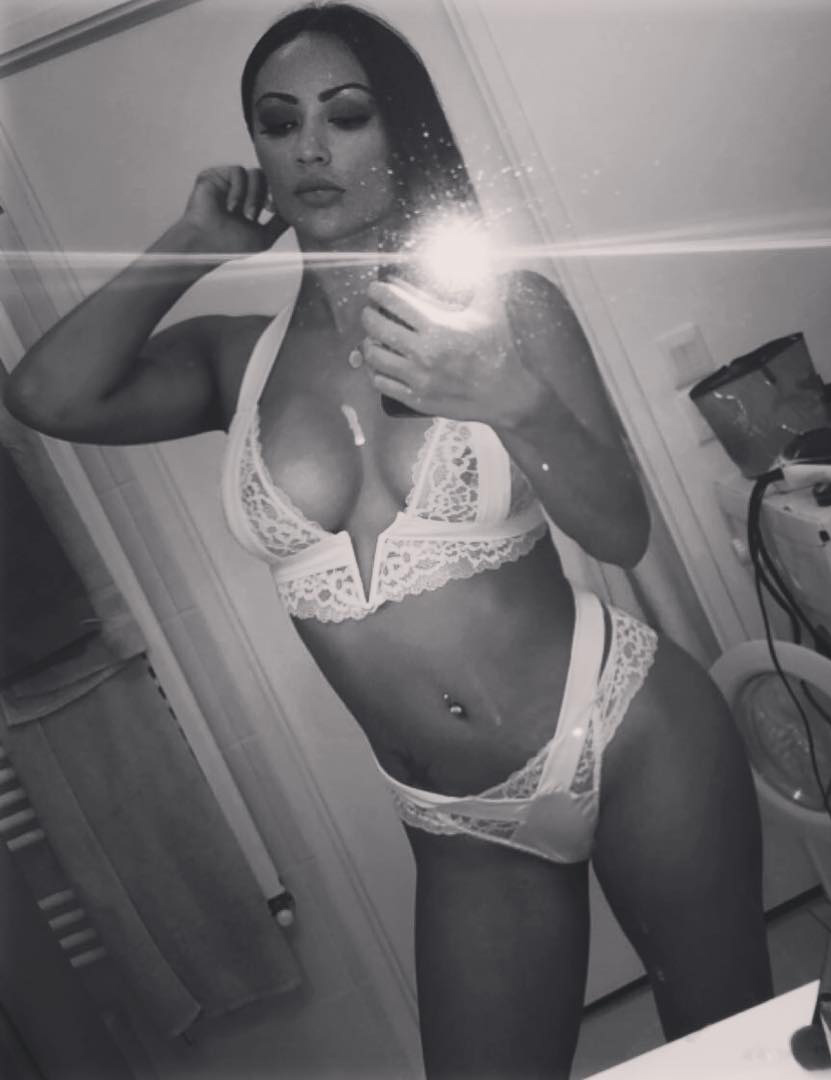 Melody Perez in lingerie taking a selfie