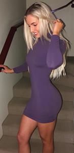 Emma Hartley sexy in a tight purple dress