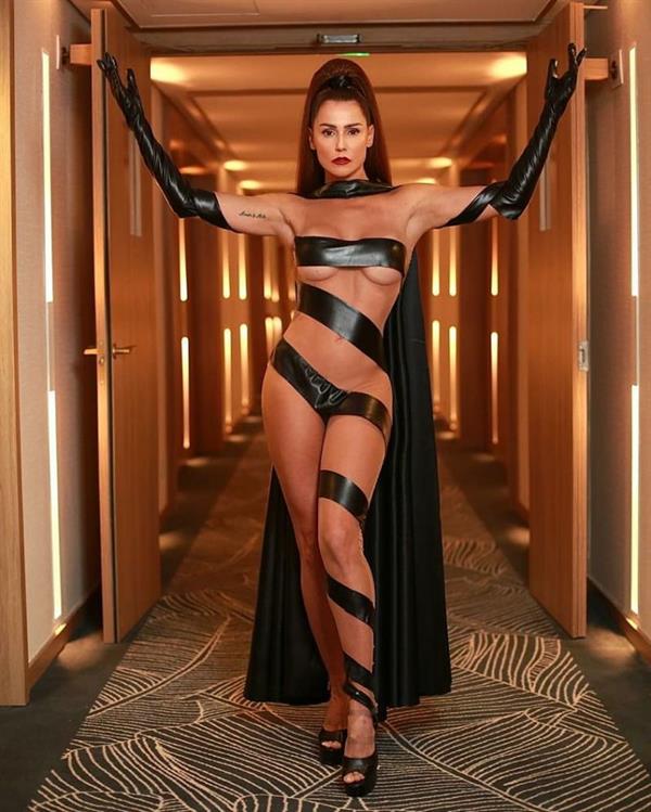 Deborah Secco nude sexy body barely covering her naked body in just black tape showing off her big tits.