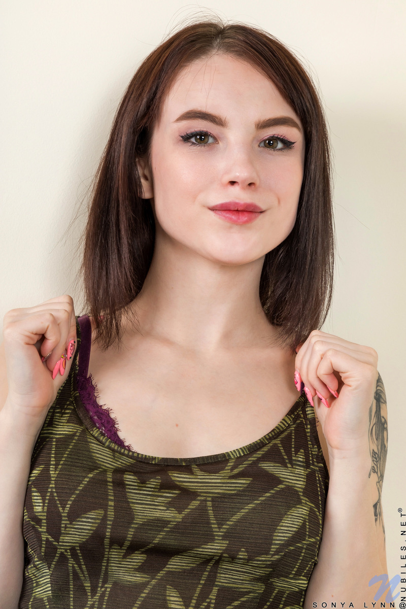 Rocker chick Sonya Lynn is waiting for her big break, but in the meantime she is in it to get herself off. She's short and plenty curvy, with small tits that stand out against her petite frame and a constant urge to rub herself down from breasts to bald twat.