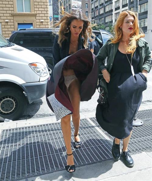 Jessica Alba Pictures Jessica Alba upskirt wardrobe malfunction accidentally flashing her panties when her dress completely flies up seen by paparazzi.