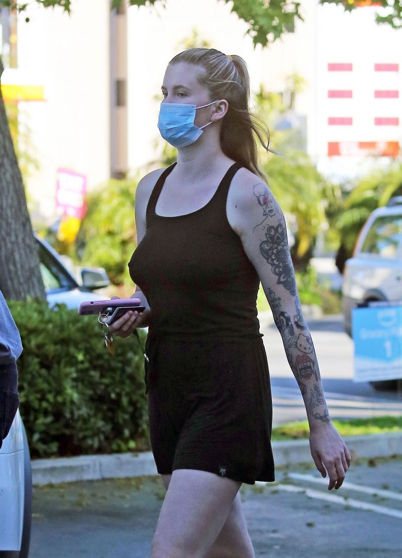 Ireland Baldwin braless boobs in a black tank top showing off her big tits pokies out shopping with her boyfriend Corey Harper seen by paparazzi.