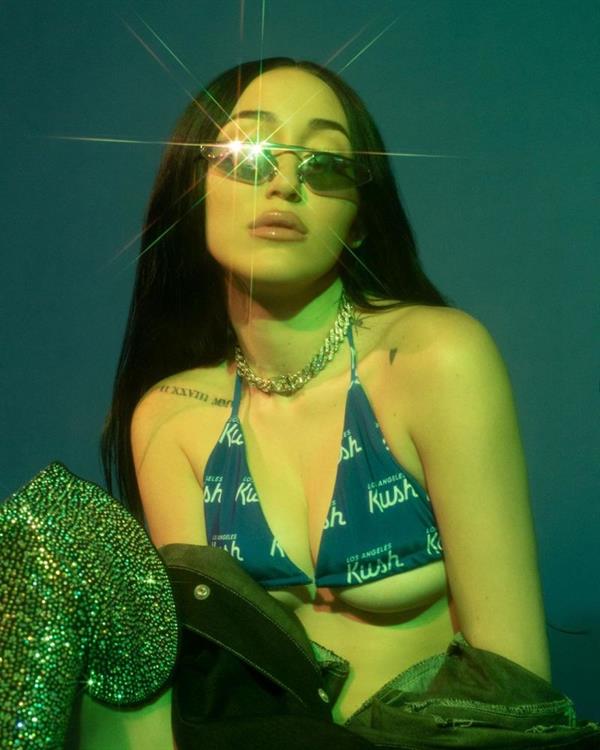 Noah Cyrus wearing a sexy blue bikini celebrating 420 showing off her hot body and nice underboob cleavage.