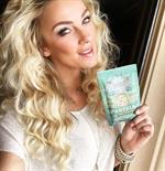 Amber Nichole Miller taking a selfie