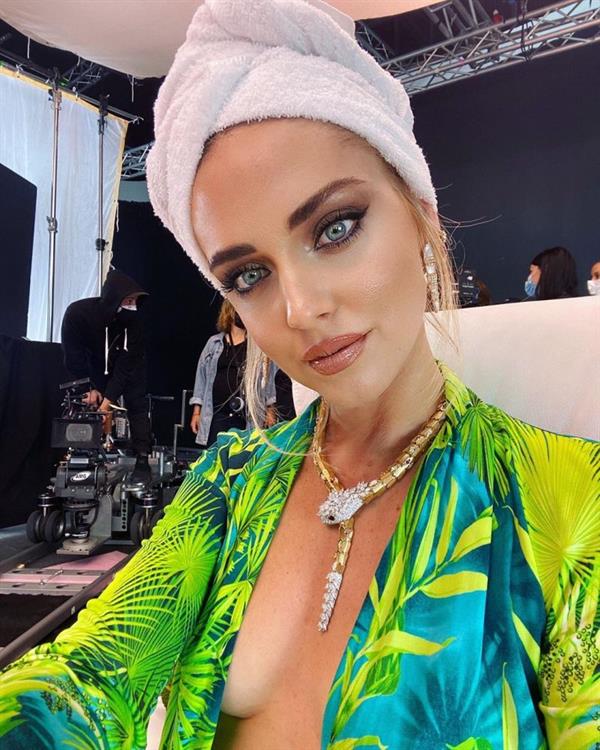 Chiara Ferragni braless boobs in an open top showing off her nice big tits cleavage captioning the photo with her being on set for something exciting.