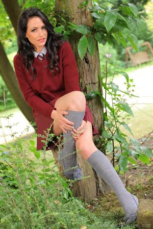  Dark haired college girl loves the outdoors and the passers by love the view of her slipping out of her uniform 