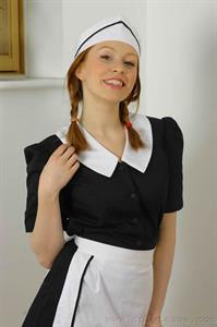  Sexy redhead Alex dressed in maids outfit with stockings 