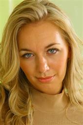  Busty blonde in a sexy brown skirt