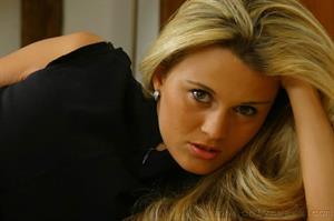  In very short secretary dress with tan pantyhose and boots 