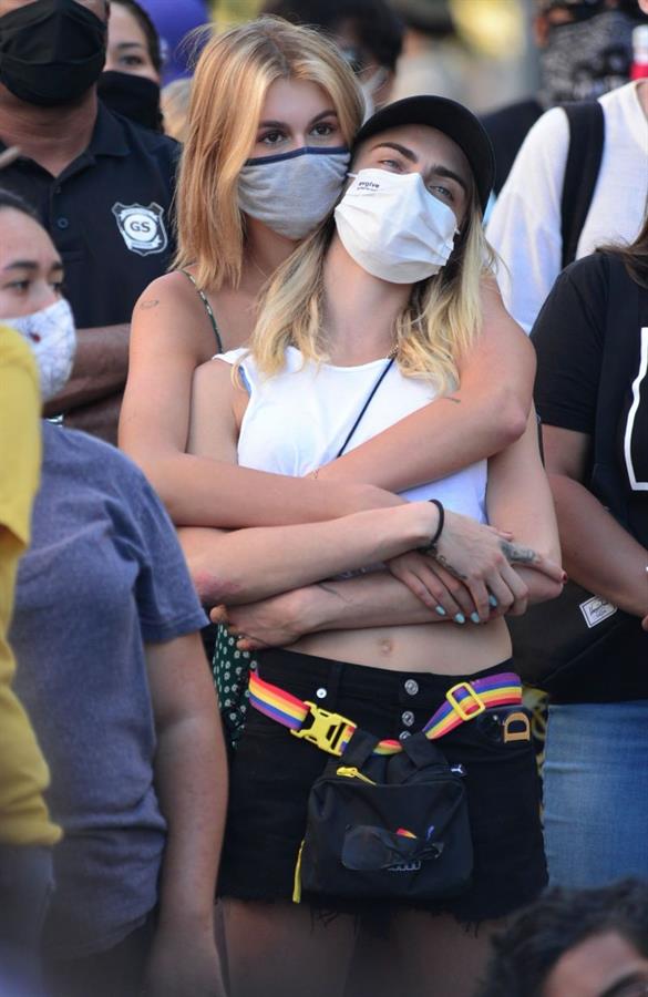 Kaia Gerber and Cara Delevingne are seen holding each other at a Black Lives Matter Protest. Famous lesbian Cara has been with a lot of the hottest female celebs.